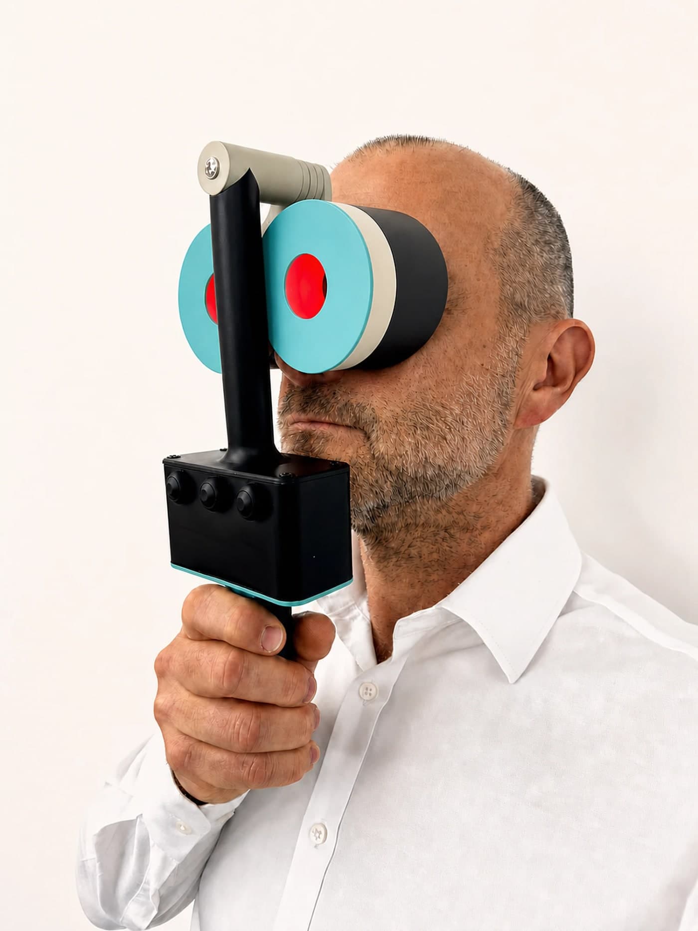 The Revolux photobiomodulation device held up to the eyes, its red therapy light visible in each eyecup